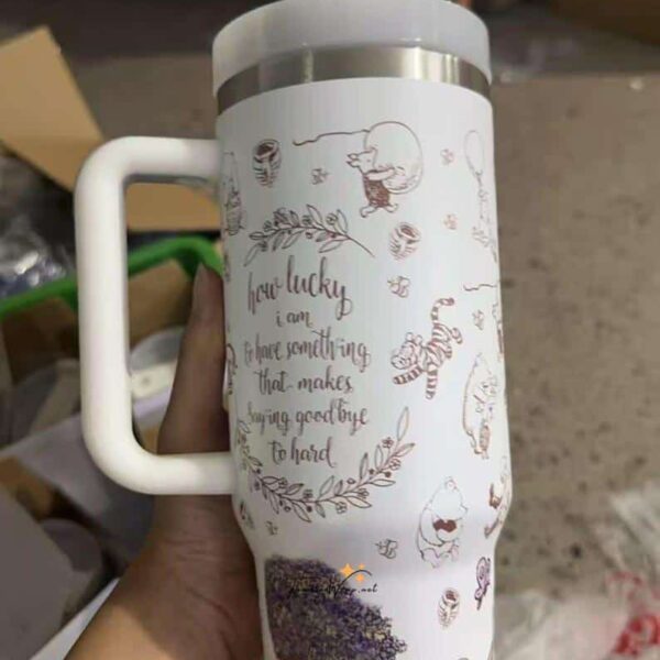 Decorative travel mug featuring cute animals and inspiring quote about luck.