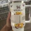 Stylish Stanley tumbler with Winnie the Pooh and butterfly designs.