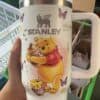 Cute Winnie the Pooh mug with butterflies and honey jars.
