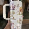 Cute Winnie the Pooh-inspired travel mug featuring adorable illustrations of Pooh, Tigger, and friends with positive quotes about life's journey.