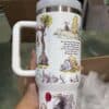 Bright mug featuring Winnie the Pooh and friends with inspiring quote.