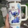 Stitch Disney character travel mug with vibrant cartoon design and "Stanley" text.