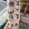 Colorful Stitch Disney characters print on insulated travel tumbler.