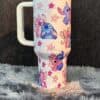 Colorful unicorn and star design on a ceramic mug for children.