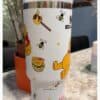 Cute bee and honey travel mug with Winnie the Pooh design.