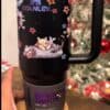 Cute cartoon animal design mug featuring playful animals and floral accents.