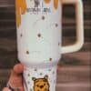 Custom Winnie the Pooh insulated tumbler with bees and honey drips design.