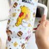 Cute Winnie the Pooh themed mug with peaceful design.