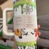 Cute Halloween mug featuring spider web and cartoon characters, fun and festive.