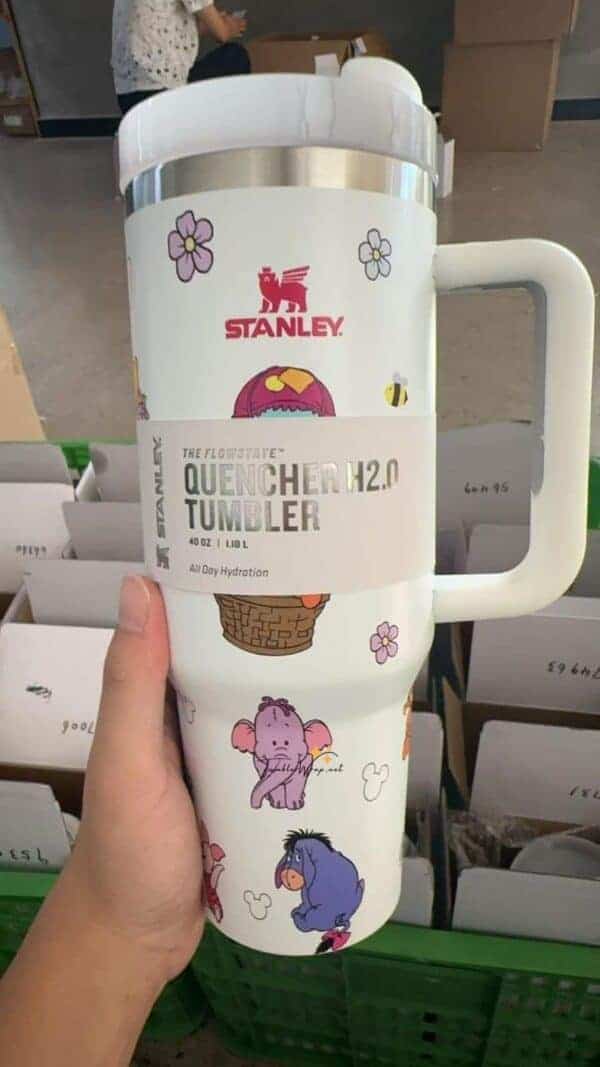 Durable insulated tumbler featuring playful animal illustrations and floral design for hydration.
