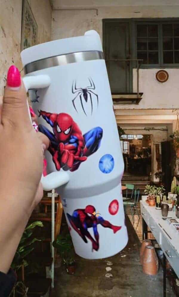Large white tumbler featuring Spider-Man and black spider graphic design.