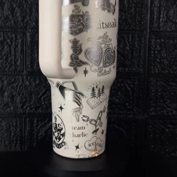 Decorative travel mug with peace, nature, and team-themed illustrations.