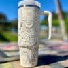 Decorative insulated water bottle with peace and spiritual symbols.