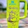 Bright yellow Shrek-themed reusable water bottle with character illustrations.