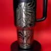Decorative peace symbol coffee mug with artistic design.