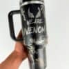 Black venom-themed travel mug with venomous character art.