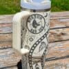 Bright white insulated tumbler featuring Halloween motifs and Boston Red Sox logos, perfect for fans.