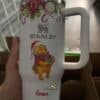 Holiday Stanley thermos featuring Winnie the Pooh with Christmas decorations and candy canes.