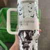 Halloween tumbler with spooky witch, castle, and night sky design.