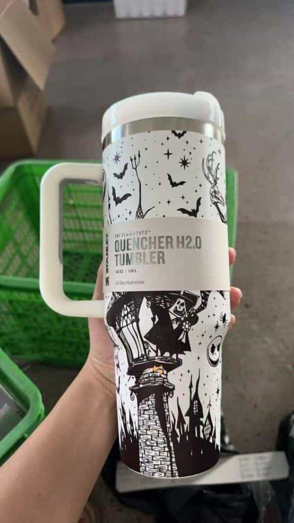 Halloween tumbler with spooky witch, castle, and night sky design.
