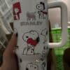 Cute Peanuts Snoopy and friends on a white coffee mug, perfect for Peanuts fans.