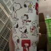 Cute Snoopy Peanuts cartoon coffee mug design.