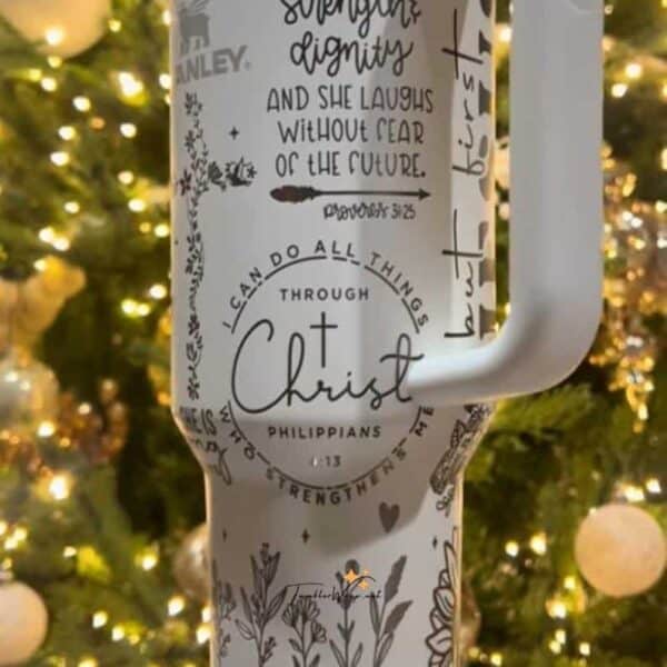 Inspirational coffee mug with scripture and floral design.