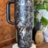 Angelic warrior illustration on travel mug, sacred and spiritual design.