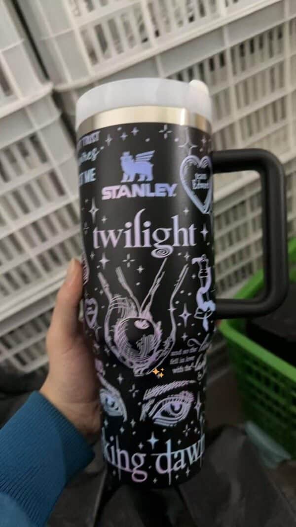 Cosmic peace theme with celestial elements on insulated tumbler.