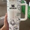 High-quality stainless steel Stanley tumbler with peace and love-themed SVG design.