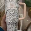 Stylish peace-themed SVG design on thermal coffee mug.