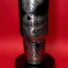 Stainless steel skull-themed tumbler with bold black and white graphics, perfect for fans of horror art.