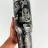Custom tumbler with fierce dragon and lion designs in black and white.