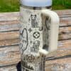 Stylish metal tumbler with peace-themed illustrations for eco-conscious living.